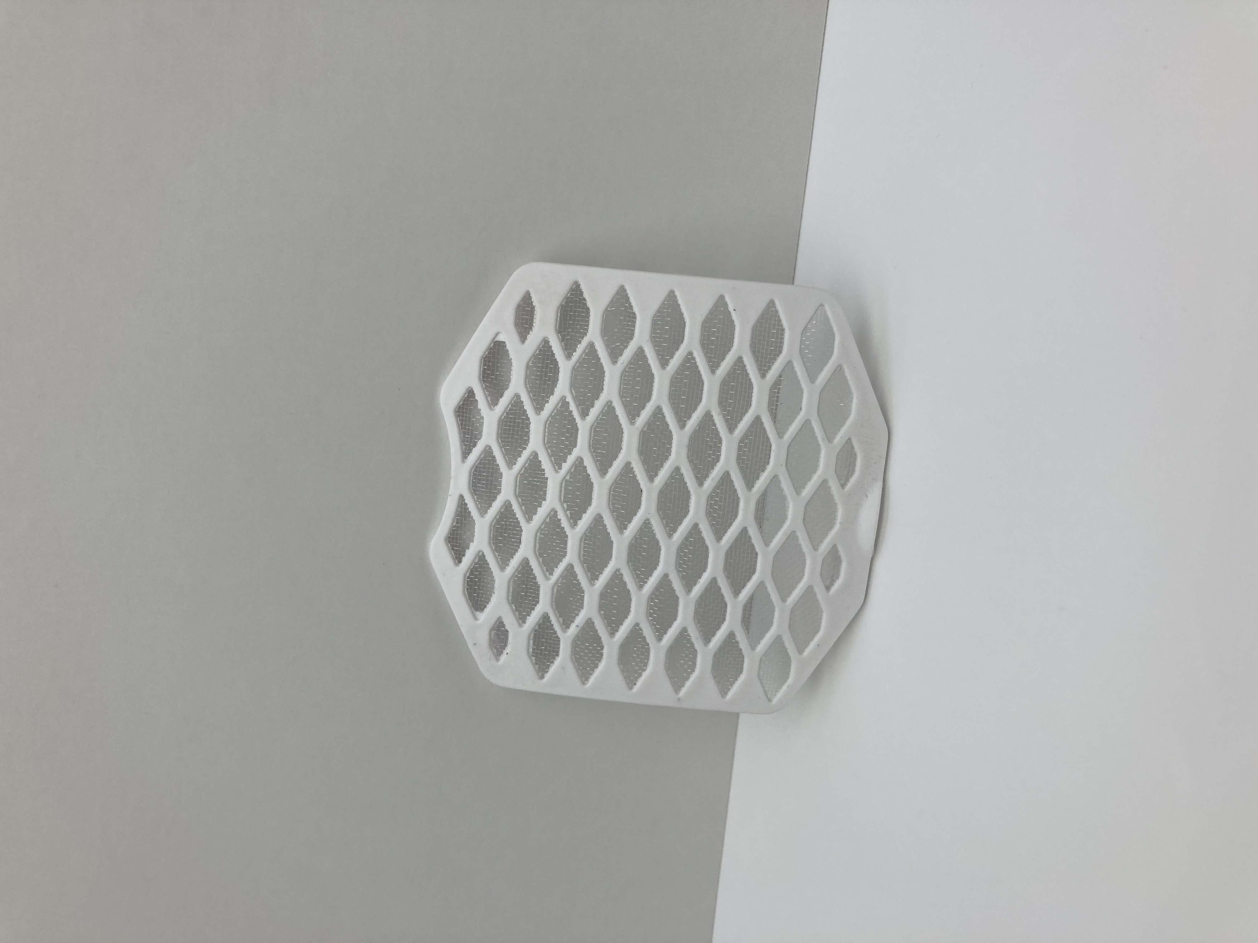 Close-up of the HeatWell ceramic heating cartridge showing its honeycomb PTC structure